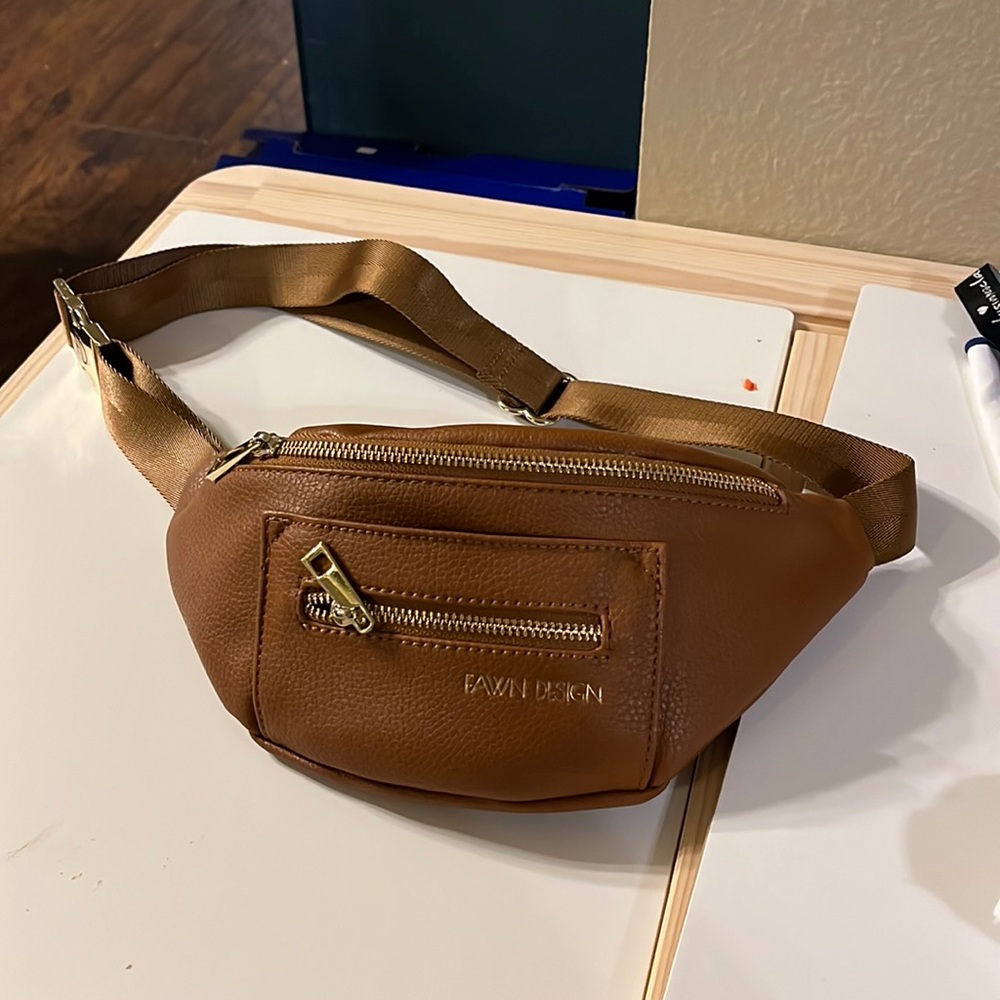 Fawn Design Fawny pack. Tan or beige in color.
